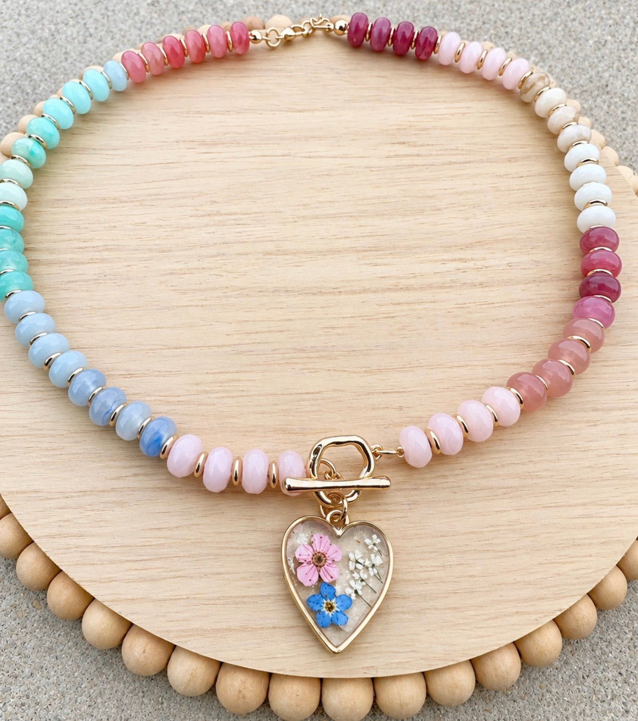 Beaded necklace with flower charm
